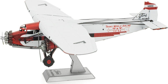 Detailed model kit of the Ford Trimotor airplane by Fascinations. The airplane features intricate design elements, including a red and white color scheme, visible engines, and landing gear. It stands on a display base, showcasing its vintage aviation charm.