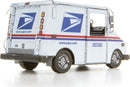 A detailed metal model of the USPS LLV mail truck by Fascinations. The model showcases intricate features such as the vehicle's rear, showcasing the USPS logo and reflective lights.