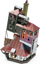 A colorful, detailed metal model kit of 'The Burrow' from Fascinations, showcasing intricate architectural features like windows, chimneys, and multiple roof types, perfect for DIY enthusiasts.