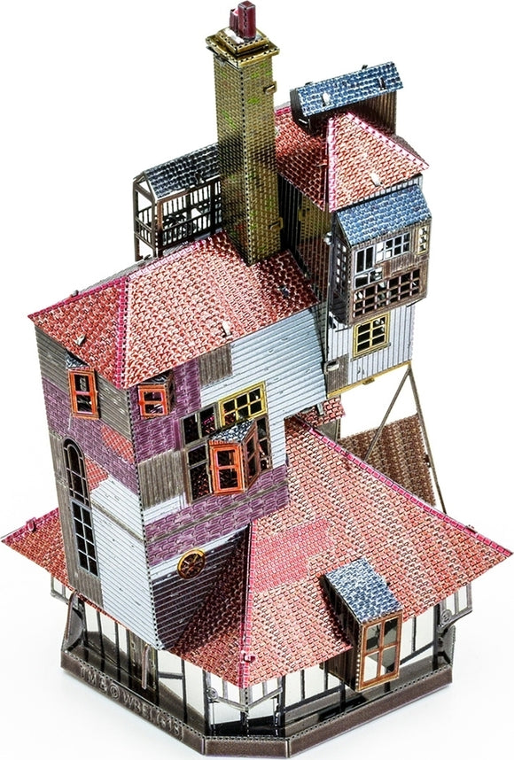 A detailed metal model of The Burrow, featuring a multi-tiered structure with intricate roofing, a chimney, and colorful windows. The kit showcases a unique design reminiscent of a whimsical house, composed of metallic pieces with various colors and textures, perfect for enthusiasts and DIY lovers.