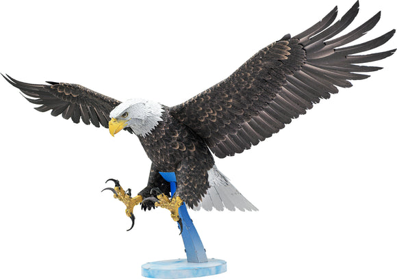 A detailed DIY kit model of an American Bald Eagle by Fascinations, showcasing intricate designs and vibrant colors. The eagle is depicted with its wings fully spread, emphasizing its majestic presence. The model features a blue base for stability and highlights fine details like lifelike feathers and a fierce expression.