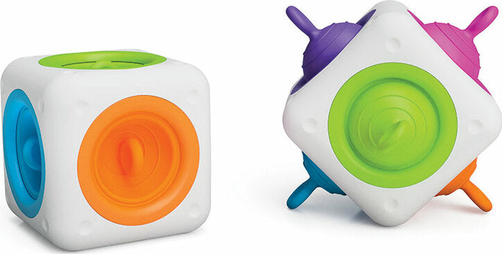 The tugl Cube by Fat Brain is a colorful, interactive fidget toy featuring spinning discs on its sides. The cube showcases various bright colors including orange, green, blue, and purple. Each side invites tactile play and encourages sensory exploration, making it ideal for stress relief and focus enhancement.