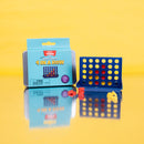 Teeny Town 4 in a Row game by Fizz Creations Inc. shows a compact game board with colorful slots and circular tokens in red and yellow. The partially-opened packaging highlights its size as the world's smallest 4 in a row game, set against a bright yellow backdrop.
