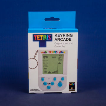Tetris Keyring Arcade Game featuring a keychain design, showcasing a vibrant graphic with the Tetris logo, a miniature screen displaying gameplay statistics like score, level, and lines, and control buttons underneath. The product is packaged in a colorful box with original sounds and gameplay, ideal for gaming enthusiasts.