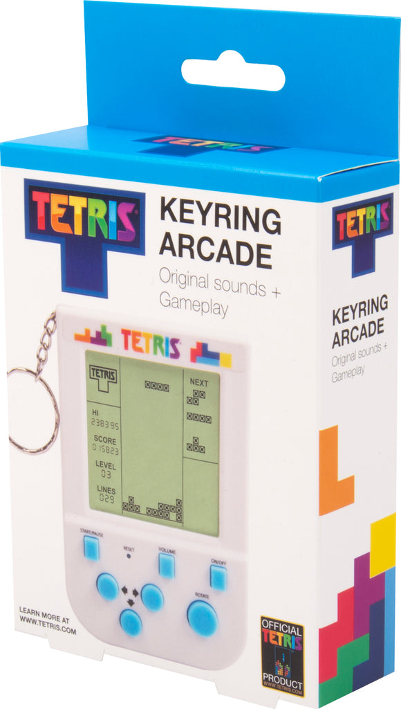 A Tetris Keyring Arcade Game by Fizz Creations Inc. featuring a small handheld device with an LCD screen displaying Tetris gameplay. The keyring design allows for easy attachment to bags or keys. The game displays high score, current score, level, and lines cleared. It includes buttons for volume control, starting and pausing gameplay, and navigating the game, all set against a colorful Tetris block-themed packaging.