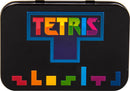Tetris Arcade In A Tin by Fizz Creations Inc. featuring a colorful Tetris logo on a sleek black tin box. The design showcases iconic block shapes in vibrant colors, representing the classic puzzle game.