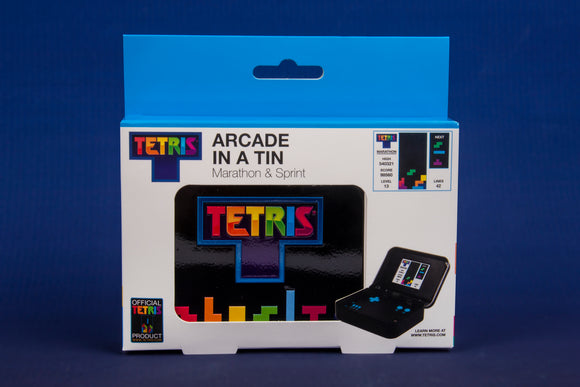 The Tetris Arcade In A Tin features a compact design showcasing the classic Tetris logo. The tin includes games in marathon and sprint modes. The product box displays vibrant colors, graphics depicting Tetris gameplay, and information about high scores and levels.