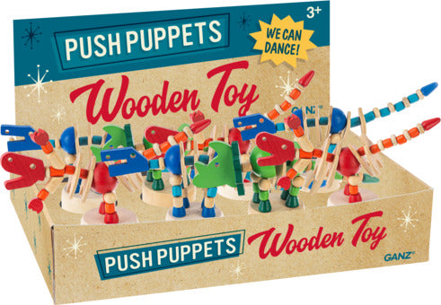 A display of colorful wooden dinosaur push puppets, each featuring vibrant colors and playful designs. The puppets are designed for young children and can dance when pushed, making them engaging toys. The packaging emphasizes that they are suitable for ages 3 and up.