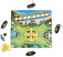 The Valley of the Vikings game by Haba features a colorful board depicting a Viking-themed landscape with spots for pieces. Surrounding the board are miniature Viking boats, tokens in bright colors, and various game pieces including a character figure and gold coins, perfect for engaging family play.