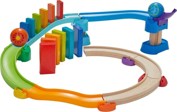 The Kubu Ball Track Kringel Domino is a colorful DIY toy set from HABA. It features a winding track with a mix of vibrant wooden blocks and a rolling ball, designed for engaging play. The track includes curves, straight sections, and domino-style blocks, inviting creativity and logical thinking in children as they build and create their own marble run.