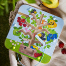 The Magnetic Game Orchard from Haba features a colorful tree with various fruits and adorable animal illustrations. Players use a magnetic tool to collect fruits while avoiding obstacles. It's set in a playful, nature-inspired design, perfect for stimulating children's fine motor skills and coordination.