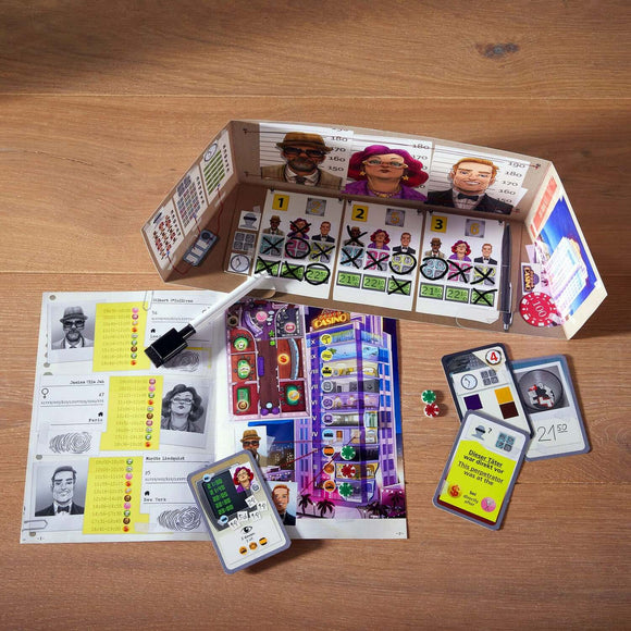 The Key Royal Star Casino game by Haba displayed on a wooden surface. The image features a colorful game board with illustrations of characters, gaming icons, scorecards, and tokens. A dry-erase marker is also included, suggesting an interactive element to the game.