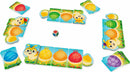 The Rainbow Caterpillar game by HABA features colorful, playful pieces with cute animal characters and vibrant designs. The pieces are arranged around a central dice, inviting players to engage in creative gameplay that encourages social interaction and imaginative storytelling.