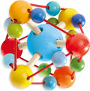 The Grasping Toy Tirili by Haba features a colorful design with various wooden balls in bright colors such as red, blue, yellow, and green. The toy is interconnected by flexible cords and wooden sticks, encouraging young children to explore textures and shapes while developing their fine motor skills.