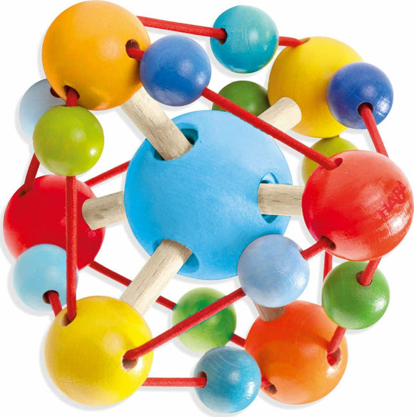 The Grasping Toy Tirili by Haba features a colorful design with various wooden balls in bright colors such as red, blue, yellow, and green. The toy is interconnected by flexible cords and wooden sticks, encouraging young children to explore textures and shapes while developing their fine motor skills.
