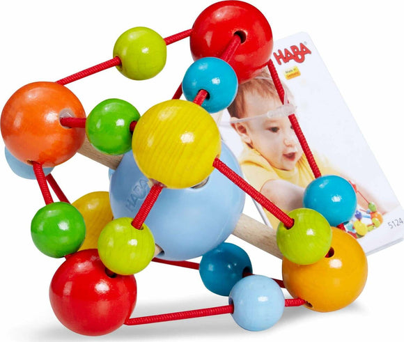 Colorful Grasping Toy Tirili by Haba featuring various sized wooden beads in bright colors like red, green, blue, yellow, and orange, threaded on elastic strings to encourage tactile exploration and sensory play for infants.