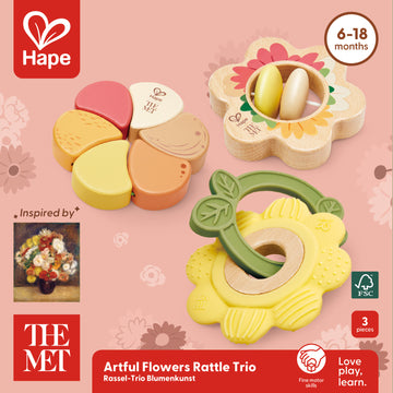 two flower-shaped rattles and a flower-shaped teether with green leaf ring