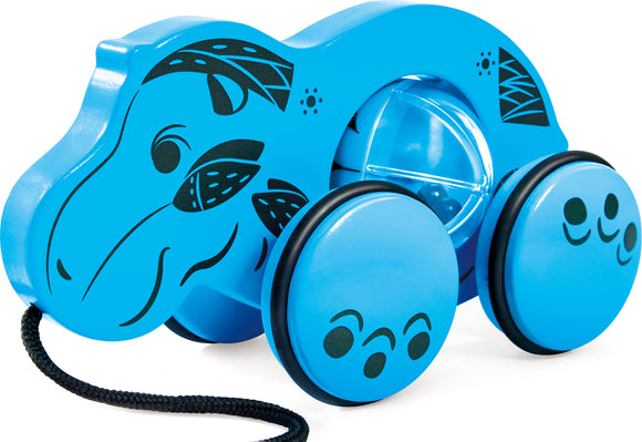 Blue hippo pulling toy with a smiley face, wheels, and floral motifs