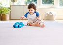 Child playing with hippo pull-along toy