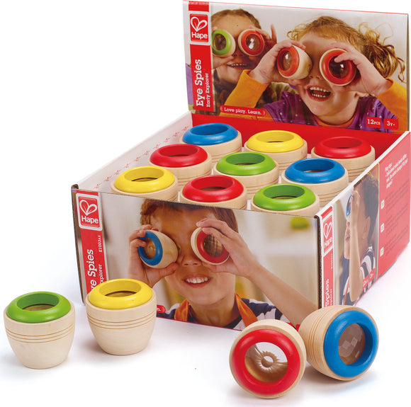 Red, Blue, Yellow, and Green eye spies, wooden tube toys with faceted plastic lenses in display box depicting children holding them up to their eyes