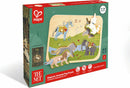 A wooden river and meadow landscape with a horse, unicorn, lion, and elephant puzzle piece with wooden dowel knobs