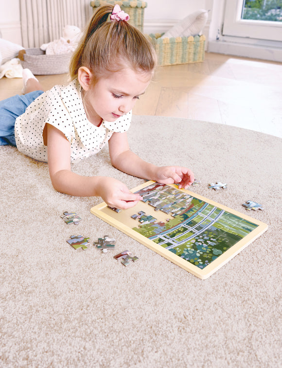 Child assembling jigsaw puzzle