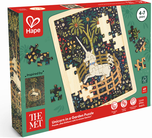 box front of wooden puzzle depicting a white unicorn in a round garden pen