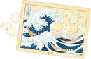 Wooden jigsaw depicting Hokusai Great Wave in light wooden frame
