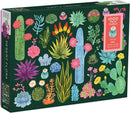 Desert Flora jigsaw puzzle by Galison featuring vibrant illustrations of various desert plants and flowers, including cacti, succulents, and bright florals. The box contains 1000 pieces, with 20 uniquely shaped pieces for added fun.