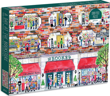 A Day at the Bookstore jigsaw puzzle by Galison featuring a colorful illustration of a bustling bookstore. The scene shows people browsing books, attending a children's storytime, and enjoying a coffee, with detailed storefronts labeled for children's books, history, art, poetry, and more. This 1000-piece puzzle captures the lively atmosphere of a community bookstore.