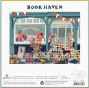 A colorful jigsaw puzzle titled 'Book Haven' by Galison, featuring a charming bookstore exterior with a bike and a dog in front. The artwork shows bright window displays filled with books and flower arrangements. The puzzle consists of 1000 pieces and has a finished size of 27 x 20 inches.