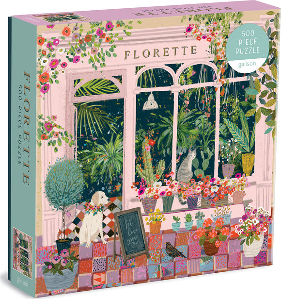 The Florette jigsaw puzzle by Galison features a vibrant and whimsical illustration of a garden room filled with various plants and flowers. The artwork depicts a cozy scene with a friendly dog wearing a floral collar, a curious cat among colorful pots, and a chalkboard sign that reads 'Let Love Grow.' This 500-piece puzzle offers both challenge and beauty, perfect for puzzle enthusiasts.