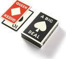 A Big Deal Giant Playing Cards by Chronicle Books displayed with the top card showing a red Queen and a black spade card partially visible. The packaging features bold graphics with a large spade symbol and the text 'A BIG DEAL' in white letters against a black background.