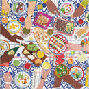 A colorful jigsaw puzzle titled 'Gather Together' by Galison, featuring an overhead view of a vibrant dining scene. Hands are reaching for various dishes filled with food, including salads, appetizers, and drinks, set against a patterned tablecloth. The puzzle illustrates a communal meal, emphasizing togetherness and the joy of sharing food.