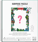 The Shelf Life Surprise Puzzle by Galison features a colorful and intricate floral design that frames a central question mark. This 1000-piece jigsaw puzzle encourages creativity as you piece together the scene, revealing hidden images and details. Perfect for puzzle enthusiasts and those looking for a delightful challenge.
