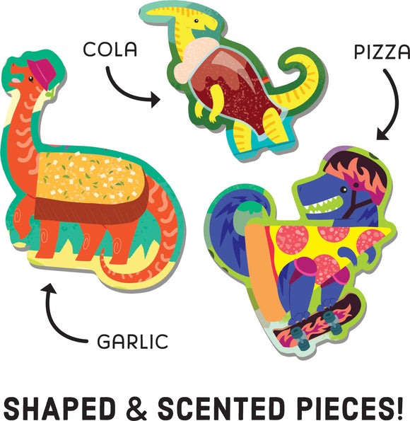 The Scratch and Sniff Pizzasaurus jigsaw puzzle features vibrant, colorful dinosaur-shaped pieces, including a dinosaur with a pizza slice, a cola-themed dinosaur, and a garlic-themed dinosaur. Each piece offers a unique scent, promising an engaging and interactive puzzle experience.