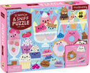 The Scratch and Sniff Cat Cafe jigsaw puzzle by Mudpuppy features colorful, whimsical cat-themed desserts, including ice cream, cupcakes, and donuts. The box showcases vibrant illustrations with scratch and sniff elements, designed to engage visual and olfactory senses. The puzzle contains 60 shaped and scented pieces, making it a fun interactive experience for cat lovers and puzzle enthusiasts.