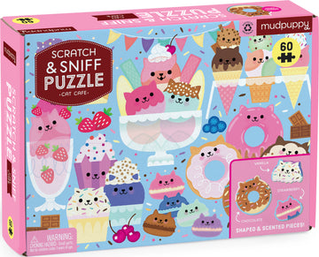 The Scratch and Sniff Cat Cafe jigsaw puzzle by Mudpuppy features colorful, whimsical cat-themed desserts, including ice cream, cupcakes, and donuts. The box showcases vibrant illustrations with scratch and sniff elements, designed to engage visual and olfactory senses. The puzzle contains 60 shaped and scented pieces, making it a fun interactive experience for cat lovers and puzzle enthusiasts.