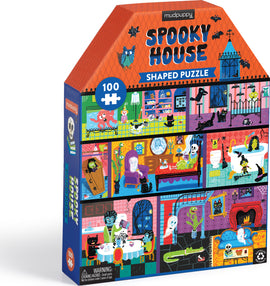 The House Shaped Spooky House jigsaw puzzle by Mudpuppy features a colorful, whimsical design of a haunted house. The packaging showcases various rooms filled with friendly ghosts, playful cats, and charming spooky decorations, making it perfect for a fun, festive puzzle experience.
