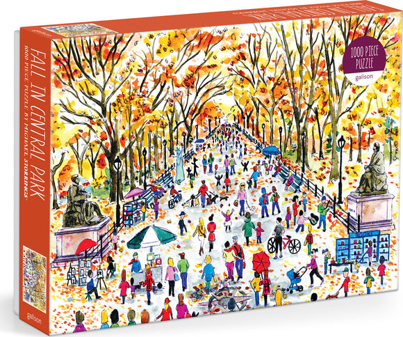 Michael Storrings 'Fall in Central Park' jigsaw puzzle by Galison featuring a vibrant autumn scene with crowds enjoying the park, colorful trees, and various outdoor activities. The illustration captures the essence of fall with warm colors and lively characters.