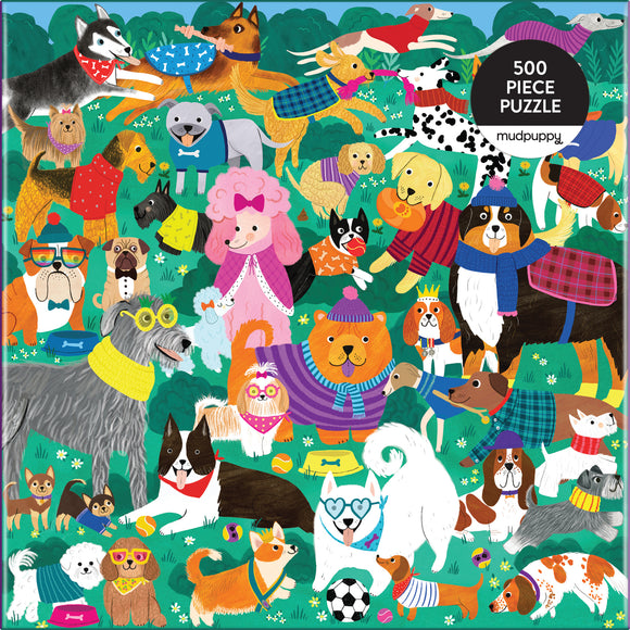 Colorful jigsaw puzzle featuring a playful assortment of cartoon-style dogs in various outfits and accessories, set against a vibrant green background with flowers. The puzzle consists of 500 pieces and is designed by Mudpuppy, perfect for dog lovers of all ages.