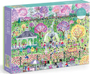 A colorful jigsaw puzzle box titled 'Easter Egg Hunt' by Michael Storrings, manufactured by Galison. The illustration depicts a vibrant park scene filled with people, bunnies, and blooming trees amidst a festive Easter egg hunt. The puzzle consists of 1000 pieces and showcases various activities such as children searching for eggs and enjoying the festivities.