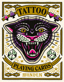 Tattoo Playing Cards by Chronicle Books features a vibrant and artistic design, showcasing a fierce black panther's face surrounded by symbols like dice and playing card suits. The bold colors and striking illustrations make it a unique game for card enthusiasts.