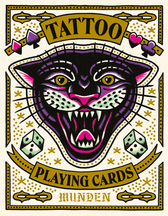 Tattoo Playing Cards by Chronicle Books features a vibrant and artistic design, showcasing a fierce black panther's face surrounded by symbols like dice and playing card suits. The bold colors and striking illustrations make it a unique game for card enthusiasts.