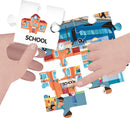 A jigsaw puzzle featuring an illustrated city scene, showcasing a school, various characters, and colorful buildings. Children's hands are seen placing the puzzle pieces together, focusing on a piece labeled 'SCHOOL'. This puzzle promotes learning and engagement.