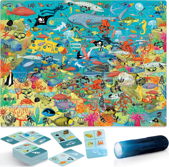 Explore the Sea Life Search and Find jigsaw puzzle featuring vibrant underwater scenes filled with various marine creatures such as fish, turtles, and sea plants. The image includes additional items like cards and a flashlight for interactive play.