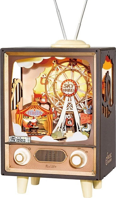 The Music Dreamer Sunset Carnival by Robotime is a beautifully crafted DIY kit that resembles a vintage television. Inside, it features a whimsical carnival scene with a ferris wheel, circus tent, and playful characters, illuminated with warm, inviting lights. The intricate design showcases creative craftsmanship, perfect for kids and adults alike who love building and display pieces.