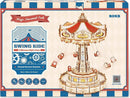 Swing Ride DIY Model by Robotime, showcasing a beautifully designed amusement park ride with intricate details and a colorful carousel top, featuring seats suspended from ropes, ideal for craft enthusiasts and model builders.