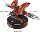 The Scout Beetle Mechanical Model by Robotime is a detailed DIY kit showcasing a steampunk-inspired design with intricate movable parts. It features prominent wings, a metallic body, and sits on a circular base with decorative engravings. Dimensions are approximately 3.94 inches in height and 7.68 inches in width.