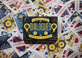 Dialogues card game box on top of cards from the game